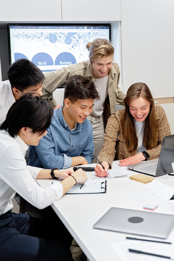 why-choose-us Diverse group of young professionals collaborating in a modern office setting.